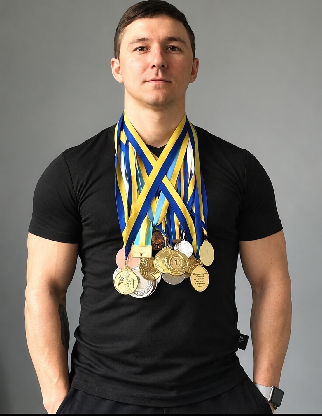 athletic champion with medal collection